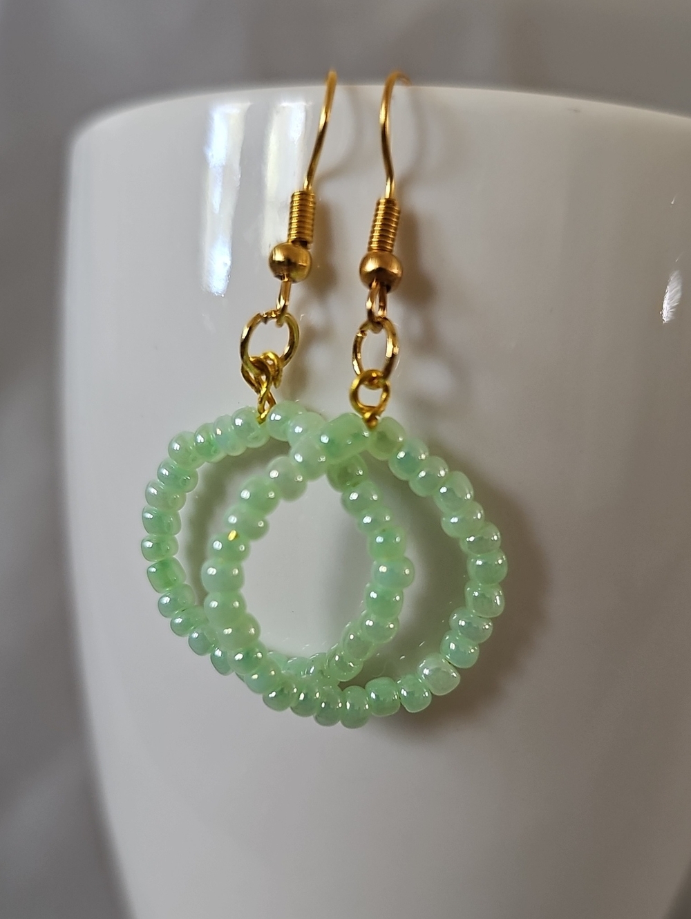 Gold Hoop Earrings with Light Green Beaded Rings